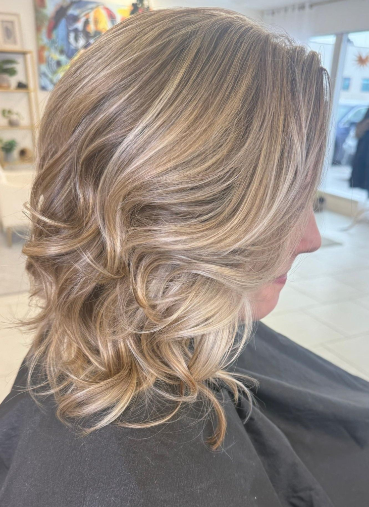 Soft dimensional blonde created with health-focused blonding techniques in a private Cedar Rapids hair studio