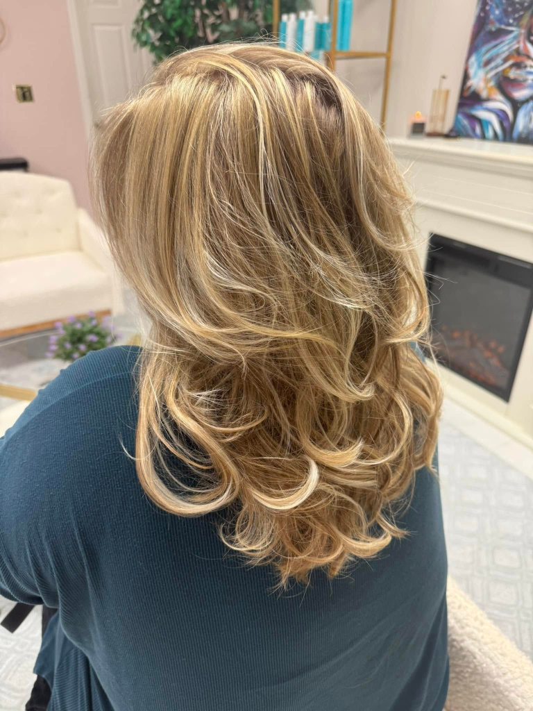 Blonding and brightening result by Cedar Rapids hair color specialist