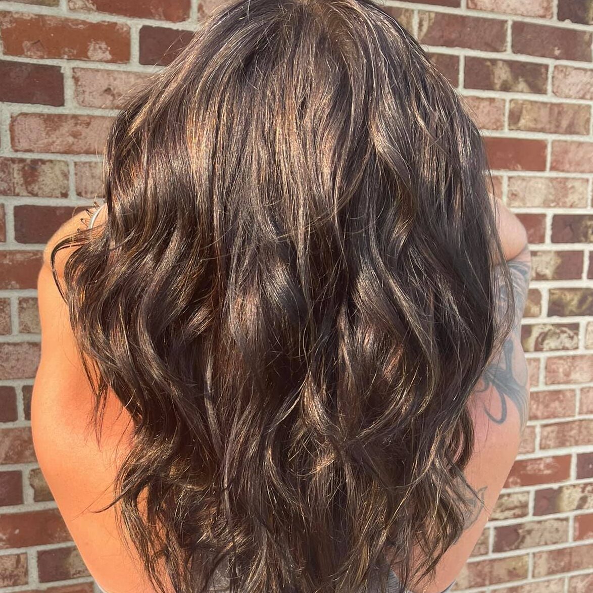 Finished balayage with bright dimension and visible movement created at Urban Vintage Hair Studio